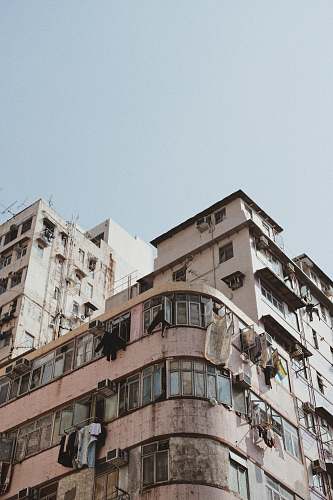 high rise white concrete building during daytime urban